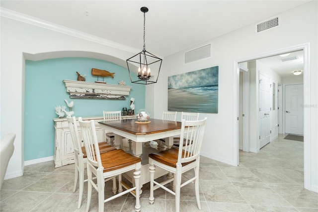 dining space with ornamental molding, visible vents, and baseboards