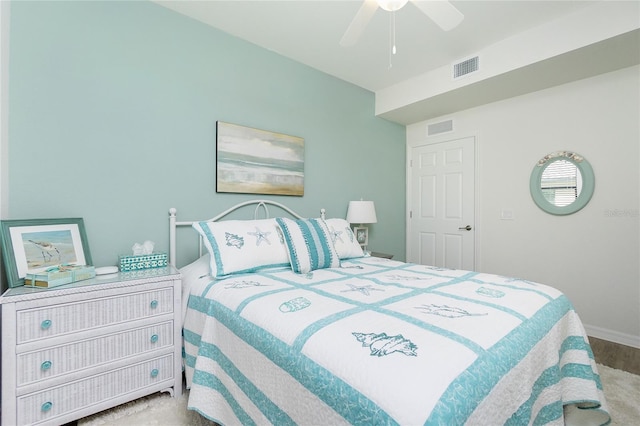 bedroom with baseboards, visible vents, and a ceiling fan