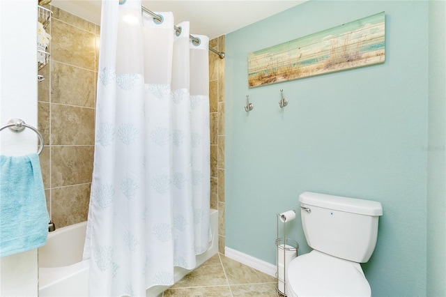 full bathroom with shower / bath combo, baseboards, tile patterned flooring, and toilet