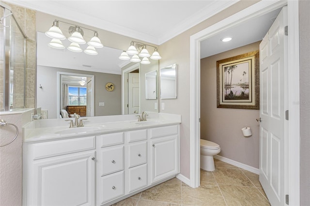 bathroom with double vanity, toilet, ensuite bathroom, crown molding, and a sink