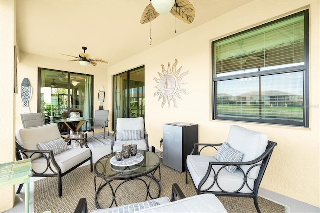 view of patio featuring a ceiling fan and outdoor lounge area