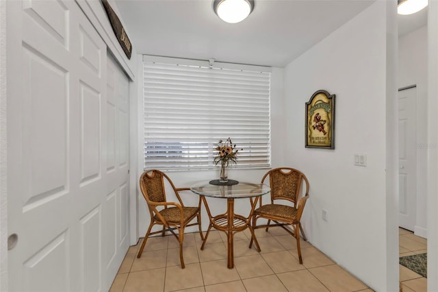 living area featuring light tile patterned flooring