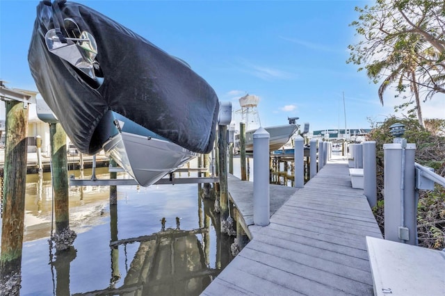 dock area featuring a water view and boat lift