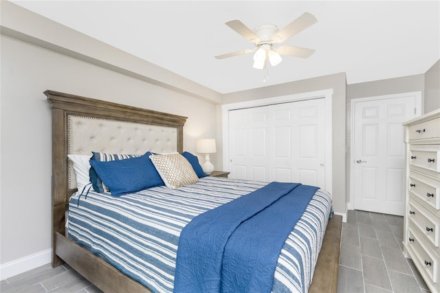 bedroom featuring ceiling fan, a closet, and baseboards