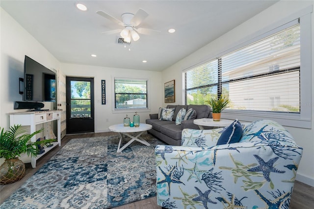 living area with recessed lighting, visible vents, a ceiling fan, wood finished floors, and baseboards