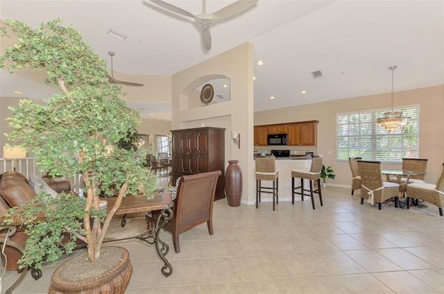 dining room with visible vents, plenty of natural light, an inviting chandelier, and light tile patterned floors