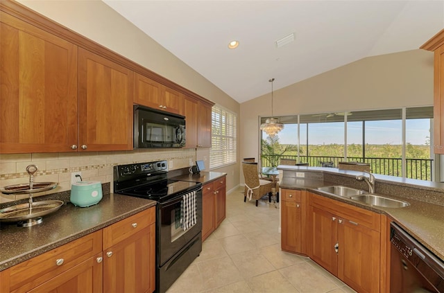 kitchen with tasteful backsplash, brown cabinetry, vaulted ceiling, black appliances, and a sink