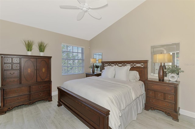 bedroom with light wood-style floors, ceiling fan, and baseboards