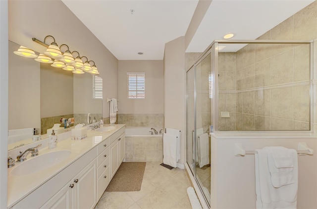 bathroom with a garden tub, tile patterned floors, a sink, and a shower stall