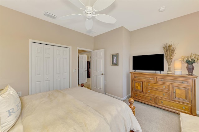 bedroom with carpet floors, a closet, visible vents, ceiling fan, and baseboards