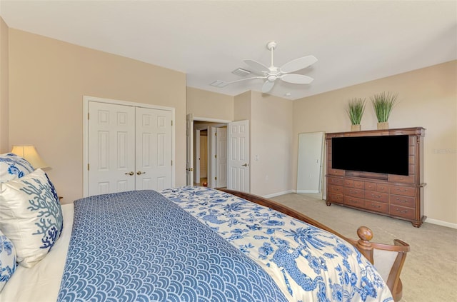 bedroom with carpet, a closet, ceiling fan, and baseboards