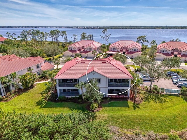 bird's eye view featuring a residential view and a water view