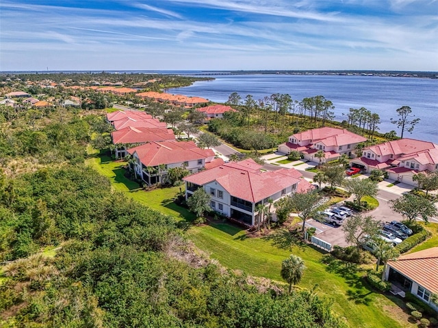 bird's eye view with a water view and a residential view