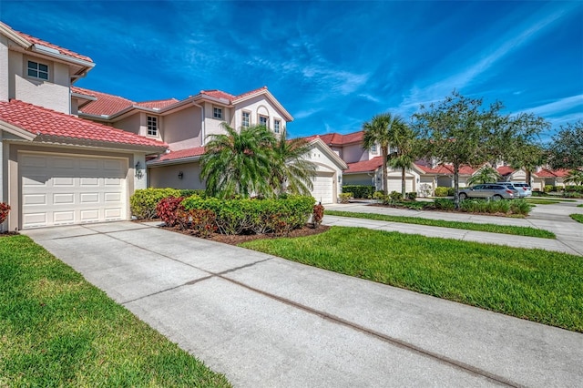 view of front of house featuring concrete driveway, an attached garage, a tiled roof, and stucco siding