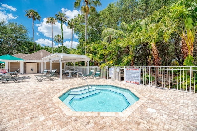 view of swimming pool with a patio area, fence, and a pergola