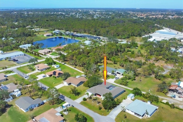 drone / aerial view with a residential view and a water view