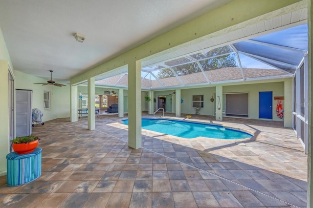 outdoor pool featuring a lanai, ceiling fan, and a patio