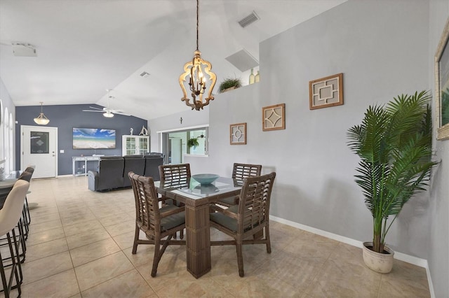 dining area with light tile patterned flooring, ceiling fan with notable chandelier, visible vents, baseboards, and vaulted ceiling