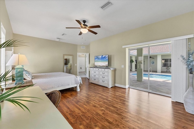 bedroom featuring ceiling fan, wood finished floors, visible vents, baseboards, and access to outside