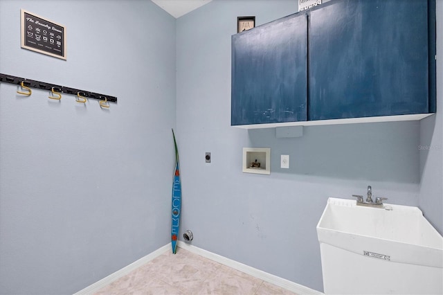 washroom with hookup for a washing machine, cabinet space, a sink, electric dryer hookup, and baseboards