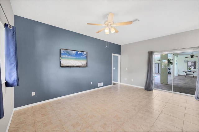 unfurnished room featuring a ceiling fan and baseboards