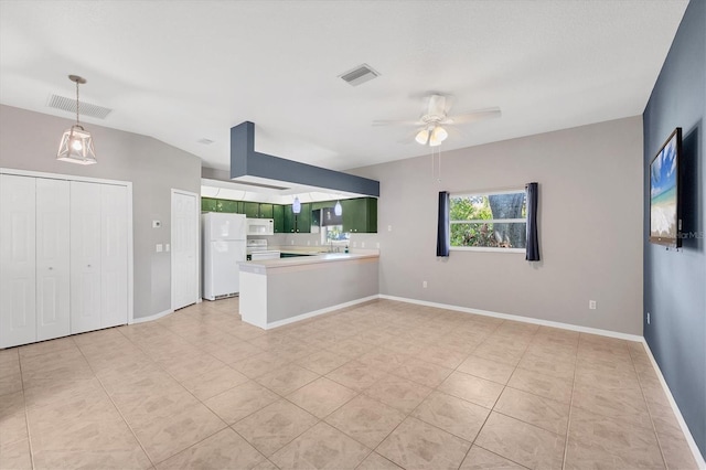 unfurnished living room with visible vents, ceiling fan, baseboards, and light tile patterned flooring