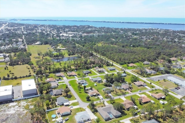 bird's eye view featuring a water view and a residential view