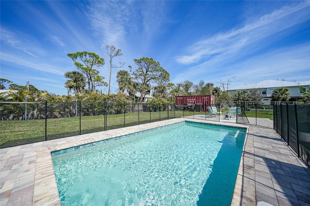 view of swimming pool with a fenced in pool, a yard, and fence