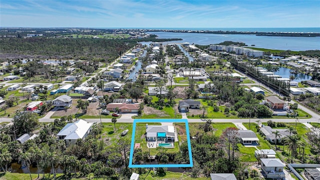 bird's eye view with a water view and a residential view