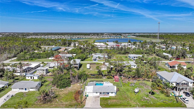 drone / aerial view with a residential view and a water view