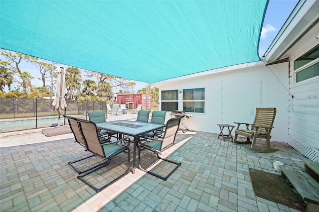 view of patio / terrace featuring outdoor dining space and fence