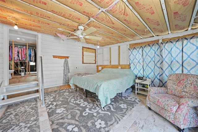 bedroom with wood walls