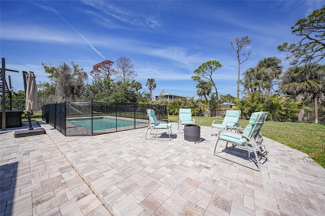 view of patio with fence and a fenced in pool