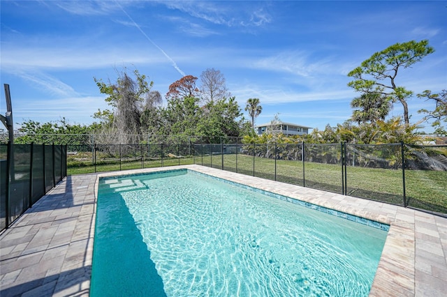 view of pool with a yard, fence, and a fenced in pool