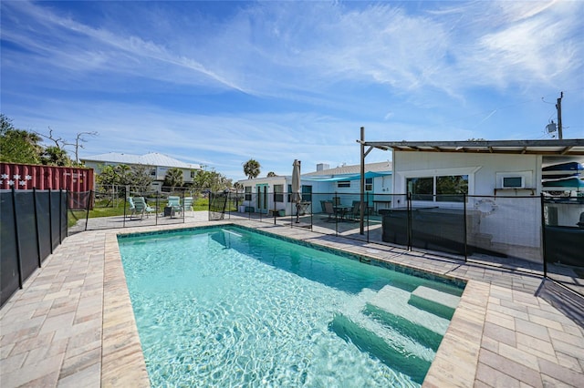 view of pool with a patio, fence, and a fenced in pool