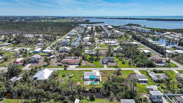 birds eye view of property featuring a water view and a residential view