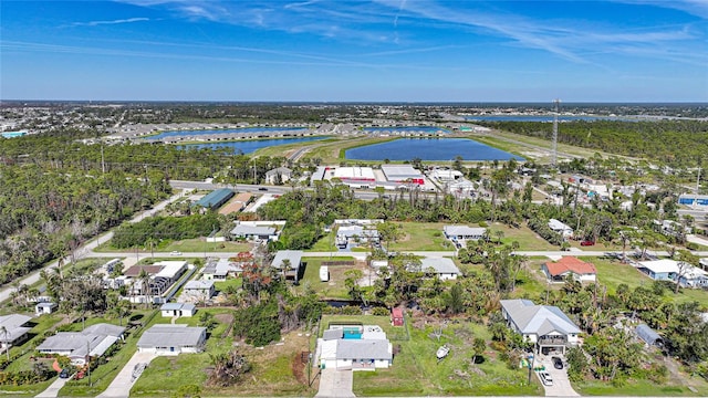 birds eye view of property featuring a water view and a residential view