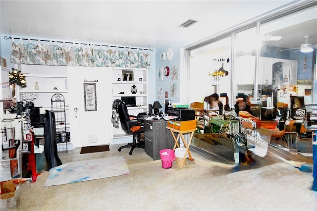 interior space featuring visible vents and a ceiling fan