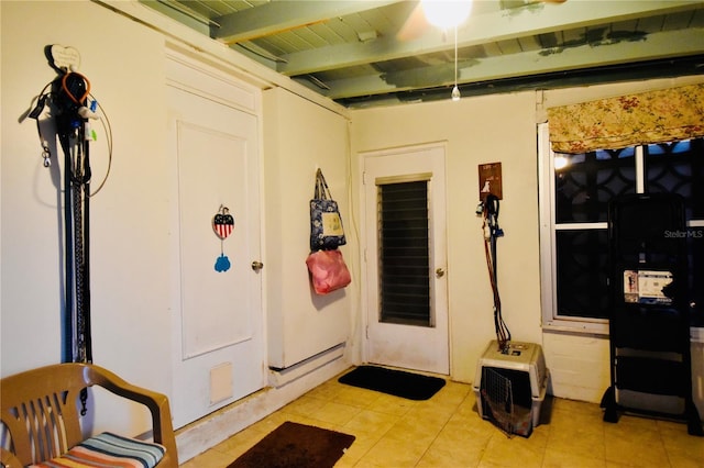 entryway with light tile patterned floors and beamed ceiling