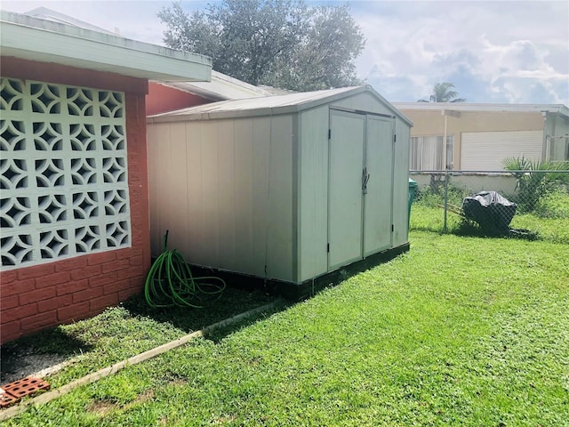 view of shed with fence