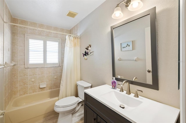 full bathroom featuring vanity, toilet, shower / bath combo, and visible vents