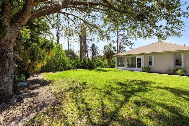 view of yard with a sunroom