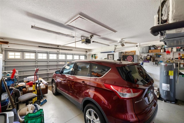 garage featuring electric water heater and a garage door opener