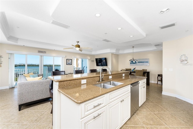 kitchen with a sink, visible vents, open floor plan, dishwasher, and a raised ceiling