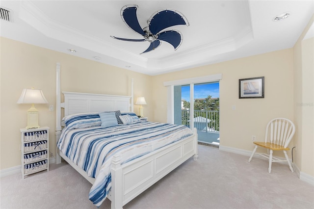 bedroom with light carpet, visible vents, access to outside, a tray ceiling, and crown molding