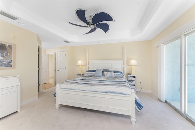 bedroom with access to exterior, visible vents, a raised ceiling, and light colored carpet