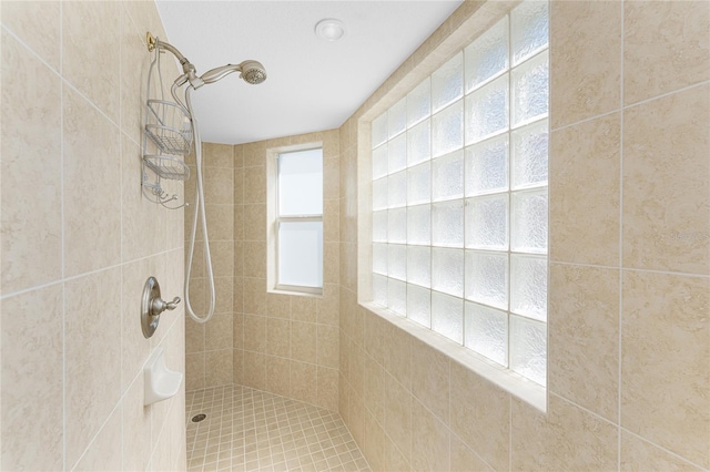 full bathroom with tiled shower