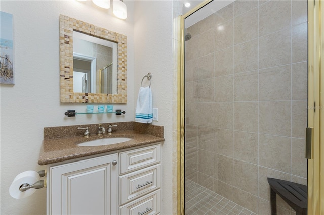 bathroom featuring a stall shower and vanity