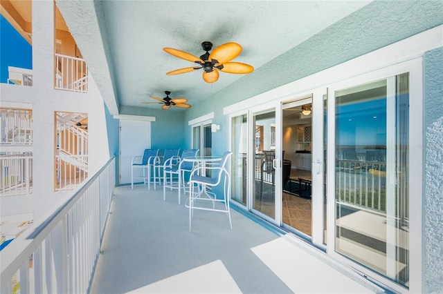 balcony featuring ceiling fan