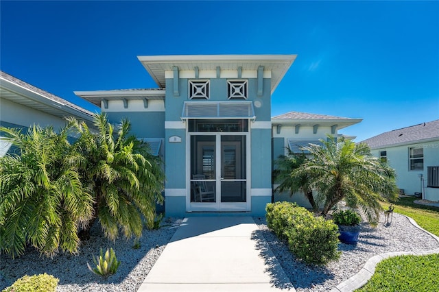 doorway to property with stucco siding